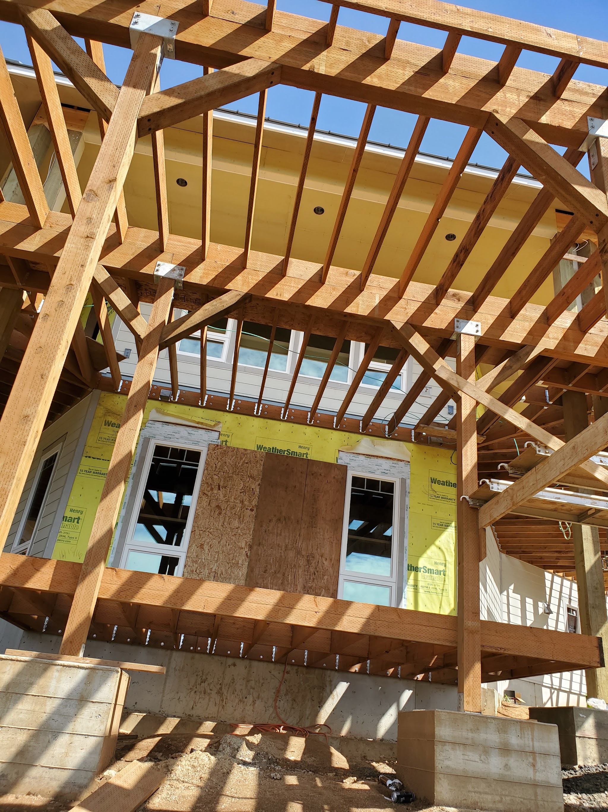 Wall framing and roof trusses on a new construction project